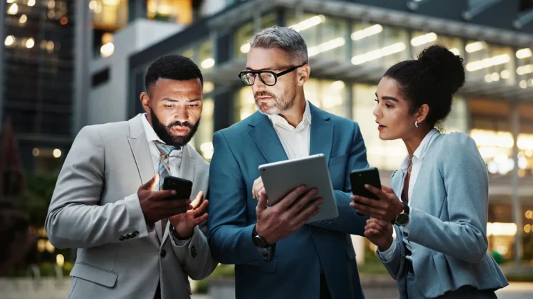 Business, people and outdoor with technology in city at night with email and communication in New York
